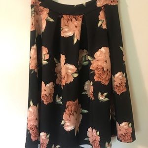 Charlotte Russe midi skirt. Black background, pink peonies